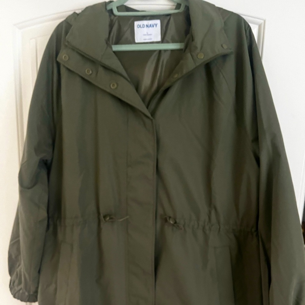 Brand new trench coat with a hood connected to jacket